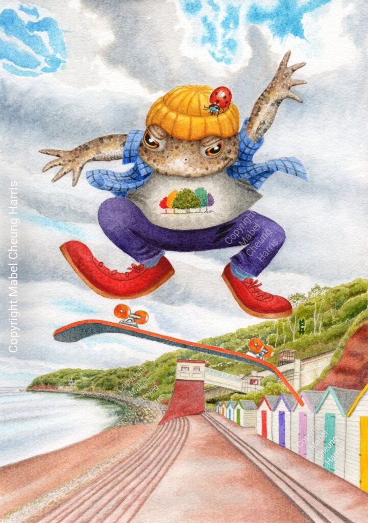 Common toad with ladybird doing fancy kick with skateboard at Oddicombe Beach, with cliff railway in background.